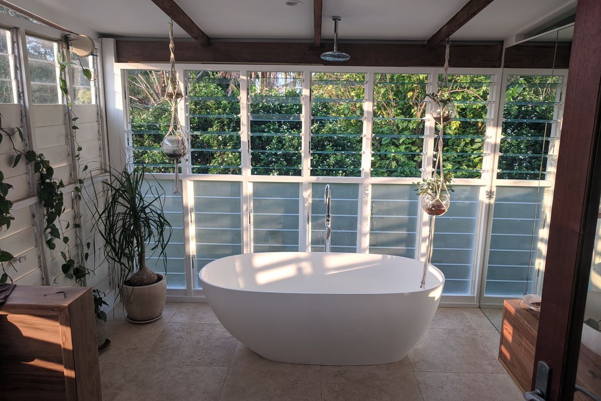 Frameless glass bathroom with recycled timber vanity